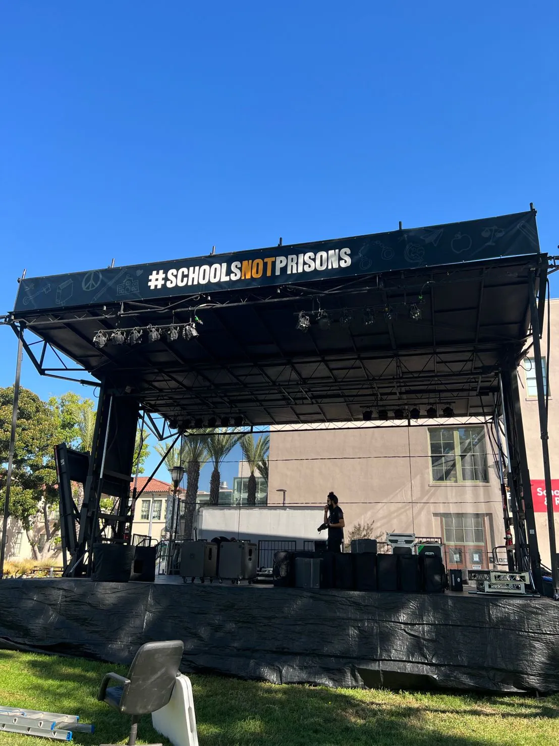 The festival stage in the round, with the movement banner running the full width of the truss.